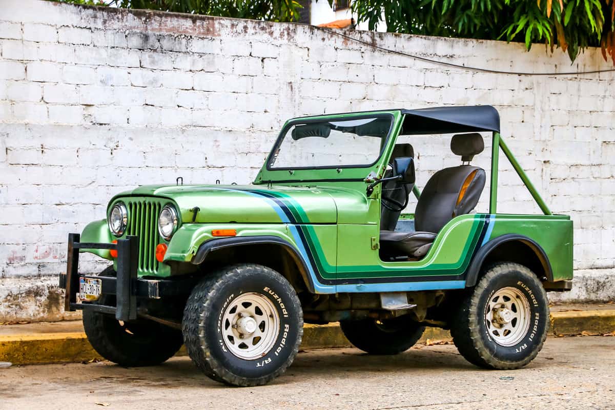 A green Jeep 1980 CJ5 parked on the side of a street. What Kind Of Jeep Does Stiles Stilinski From Teen Wolf Drive?