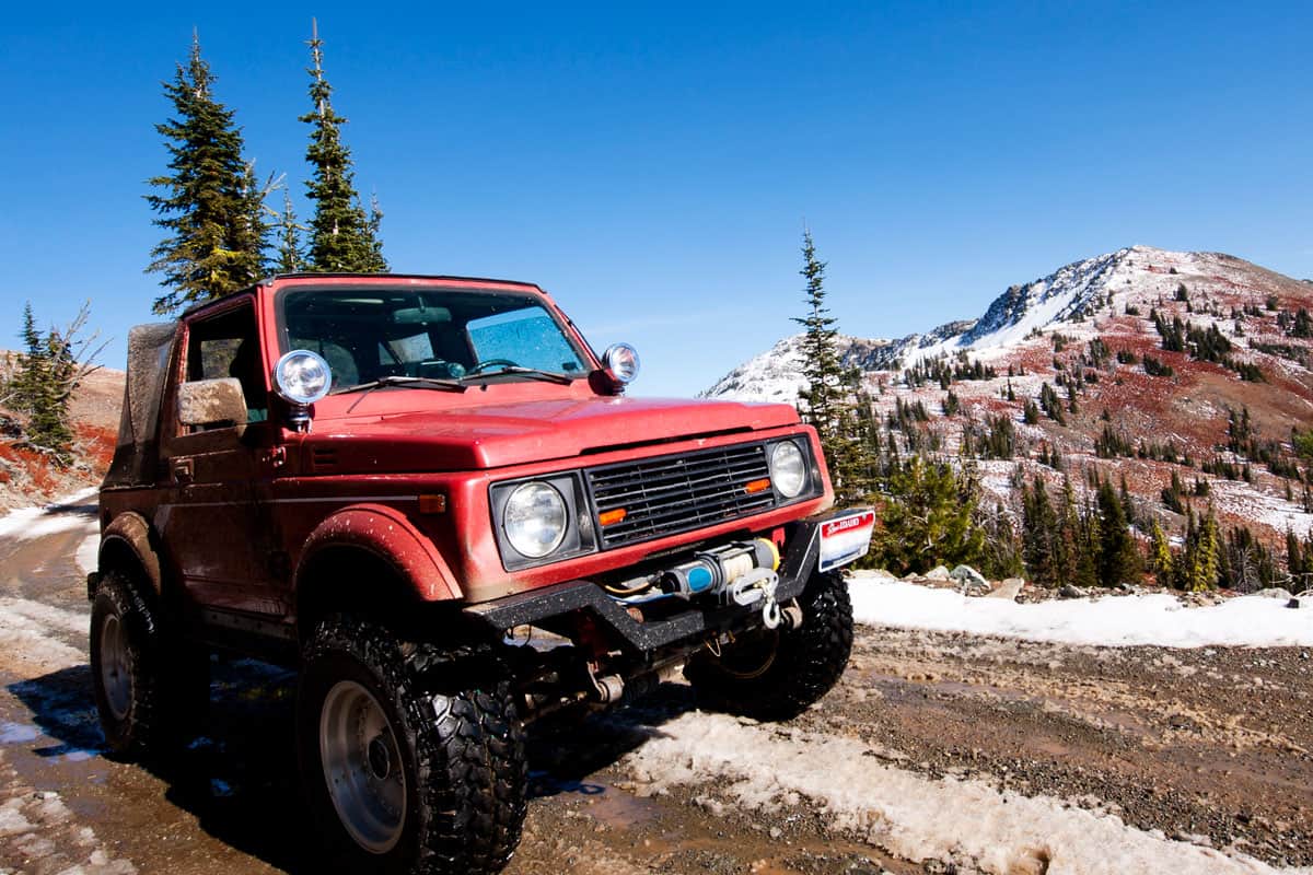 A red 4x4 on Black Lake road in the Seven Devils Mountains