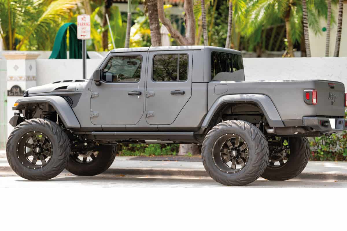 Jeep Gladiator 4x4 vehicle lifted with oversized wheels and off road tires