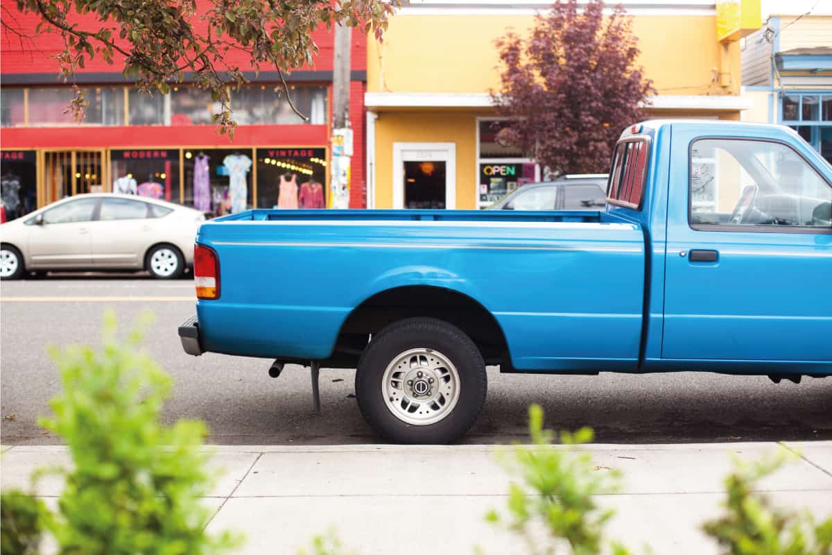 A blue pickup truck parked along a quiet neighborhood, Truck Bed Dimensions - Length and width by bed type