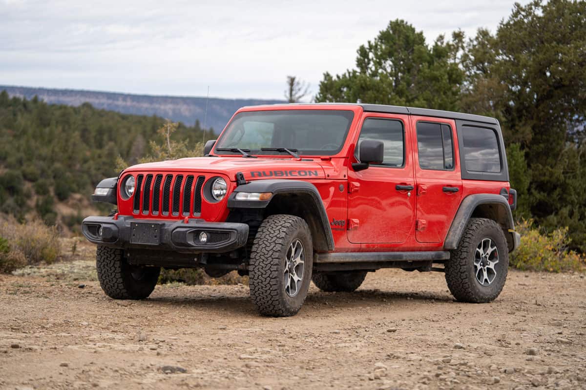 red jeep wrangler goes off roading
