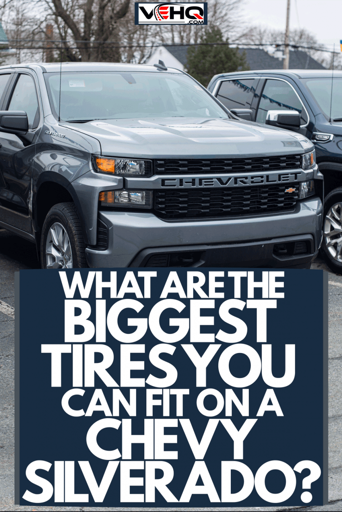 A huge gray colored Chevrolet Silverado parked outside a parking lot, What Are the Biggest Tires You Can Fit On A Chevy Silverado?