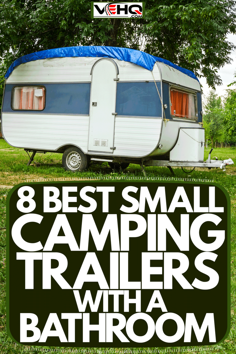 A small camping trailer parked outside a camping ground, 8 Best Small Camping Trailers With A Bathroom