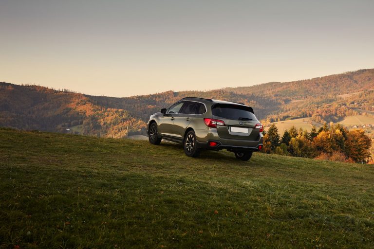 A Subaru Outback trekking the scenic view of the countryside, What SUVs Have Apple Carplay? [2021 Edition]