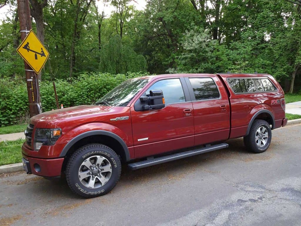 A red Ford F150 FX4 Off Road running on the streets