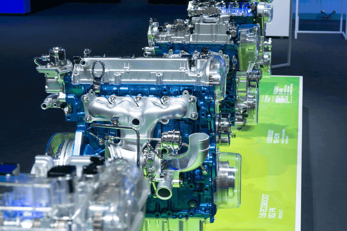 Ford Ecoboost engine lined up at a showroom of a car show, What's The Gas Mileage Of A Ford EcoBoost?