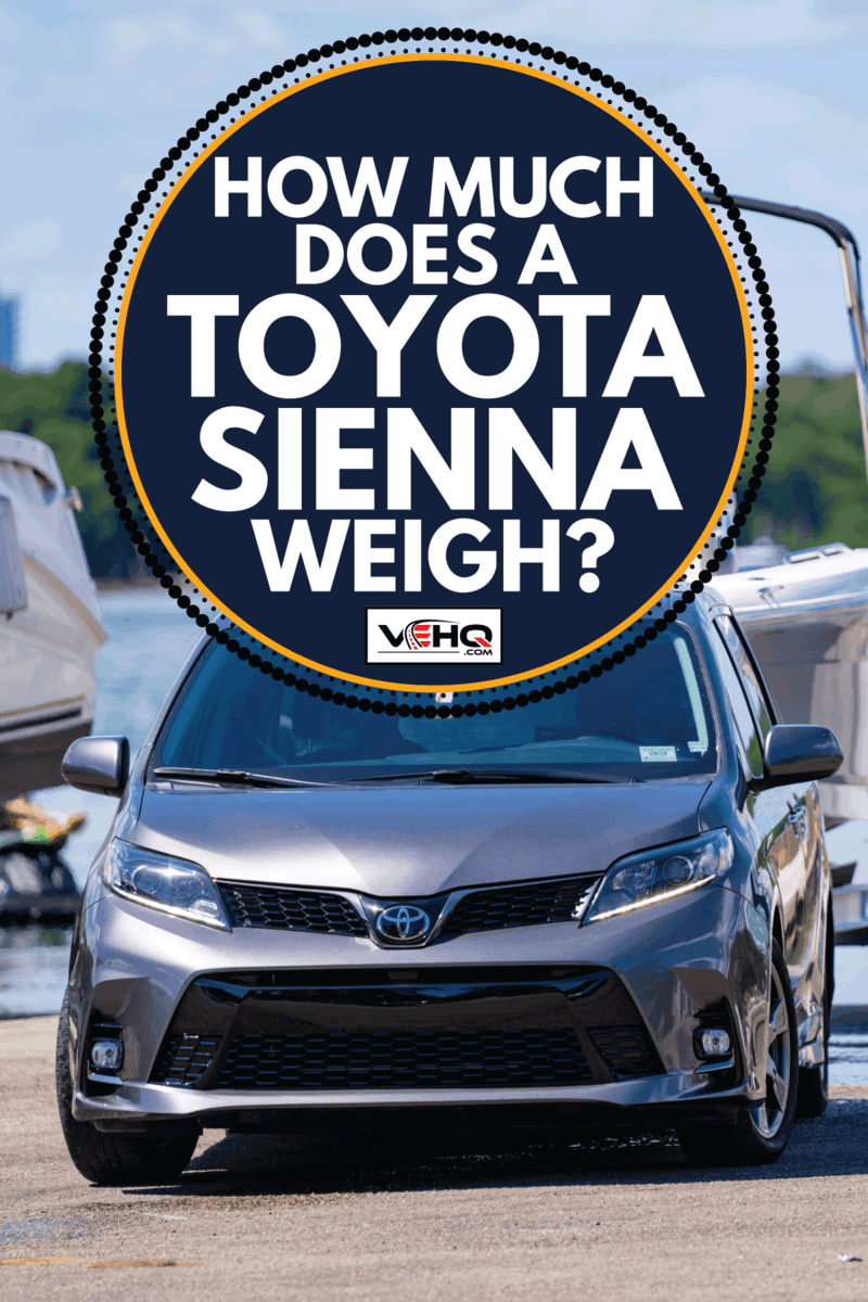toyota sienna towing a boat in a dock yard. How Much Does A Toyota Sienna Weigh