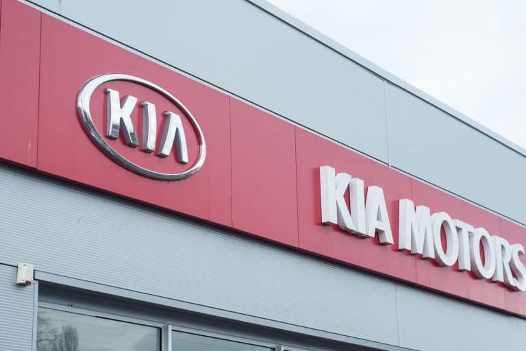 A Kia company logo photographed outside a dealership, Does The Kia Telluride Have Wifi And Apple Carplay?