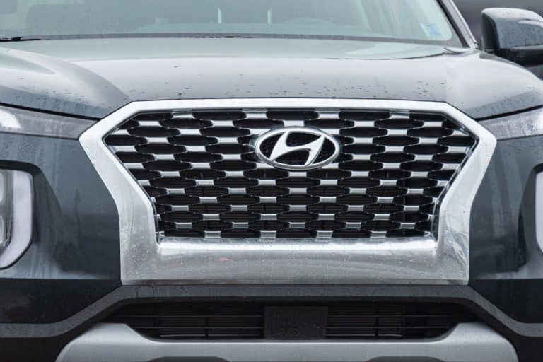 A photo of a Hyundai Palisade grill with a pure stainless steel Hyundai emblem on it, How Much Can You Tow With A Hyundai Palisade?