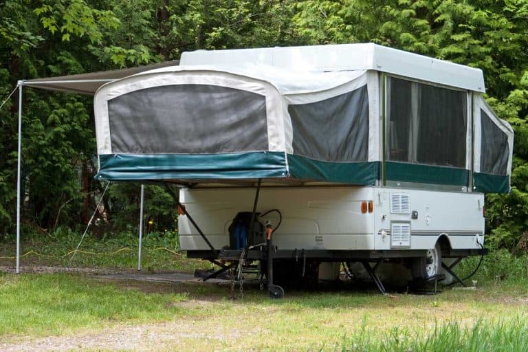 A single pop-up tent trailer in a campground, Can A Minivan Pull A Pop-Up Camper?