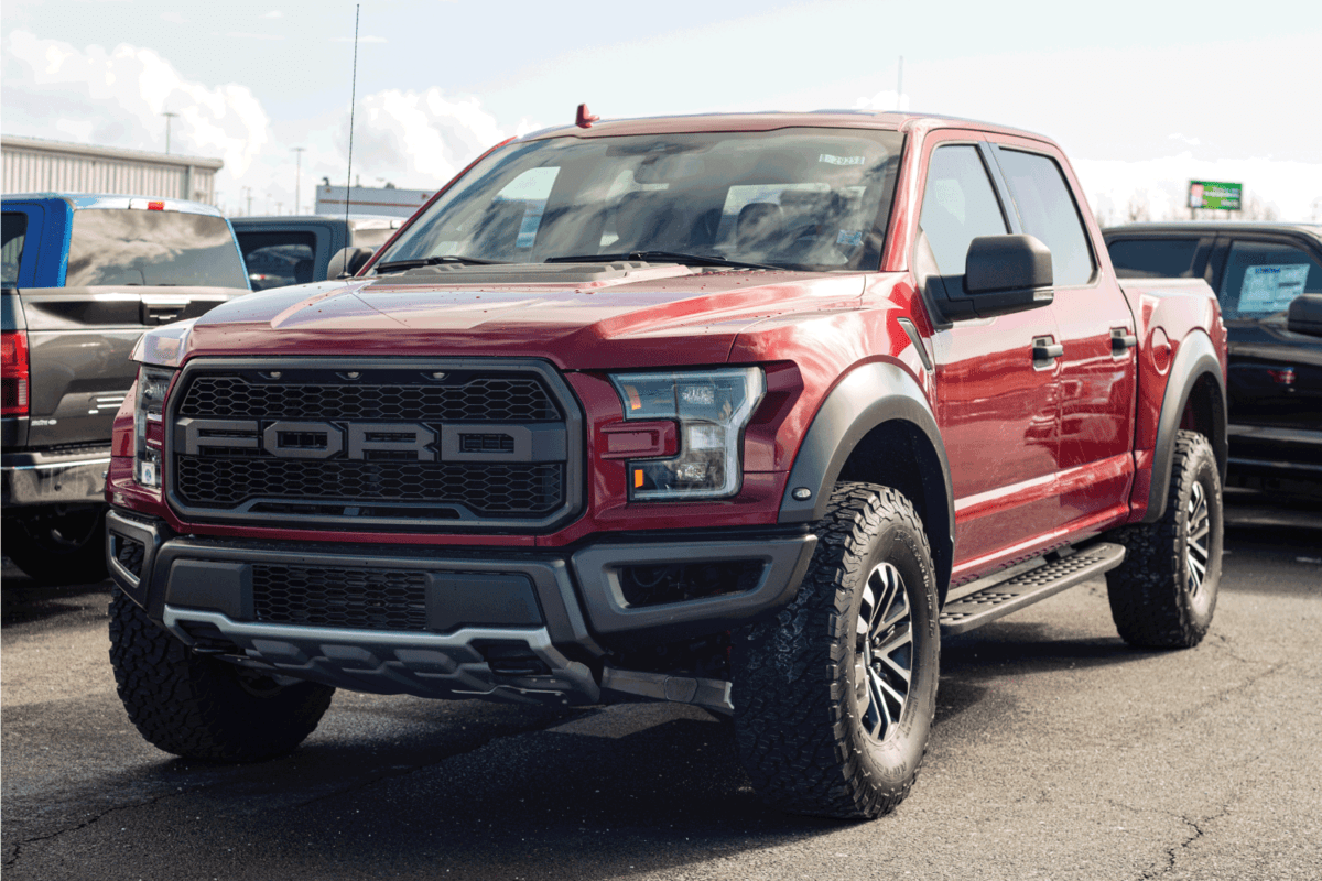Ford F-150 Raptor pickup truck in color red
