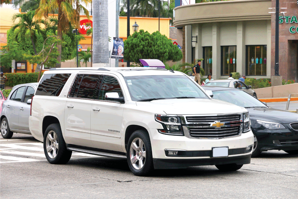 White-motor-car-Chevrolet-Suburban-in-the-city-street-looking-for-parking,-Which-SUVs-Have-Front-Parking-Sensors