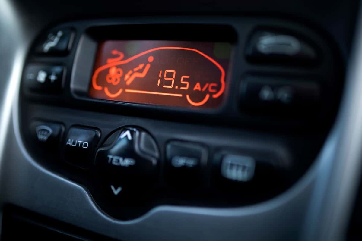 A car heater display turned on the car dashboard, Car Heat Only Works While Driving - What To Do
