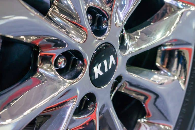An up close image of a Kia logo on the rim of a car, How To Remote Start A Kia Telluride