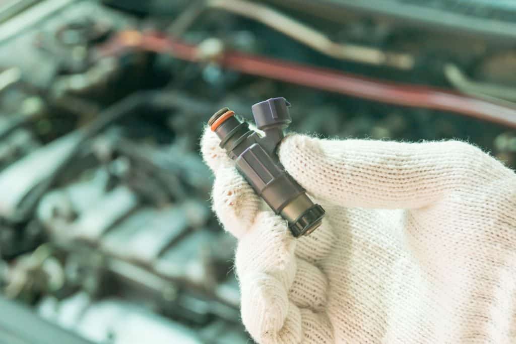 Close up of old fuel injector, Car maintenance service, How To Use A Fuel Injector Cleaner
