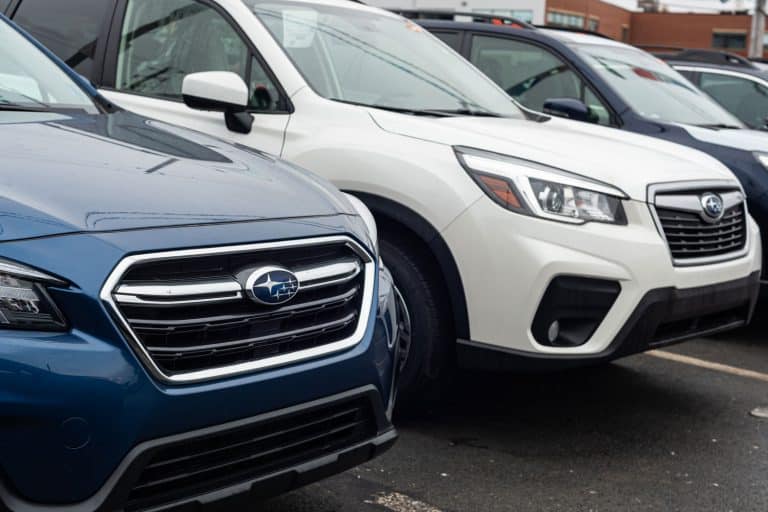 Different trims of Subaru parked outside a dealership, Can You Flat Tow A Subaru? [Everything You Need To Know]