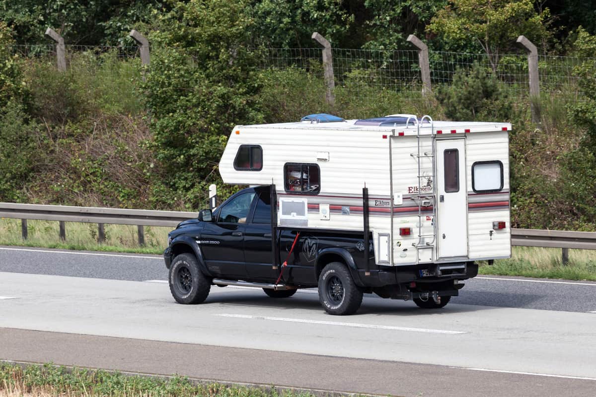 A Dodge Ram Truck Camper on the road