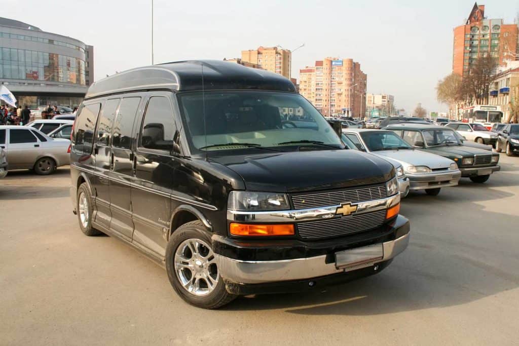 Black luxury van Chevrolet Express in the city street