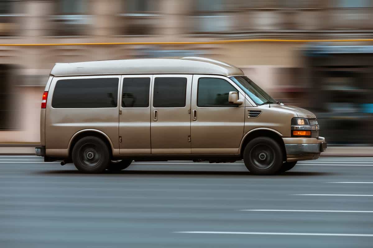Chevy Express Van captured running fast on the highway road