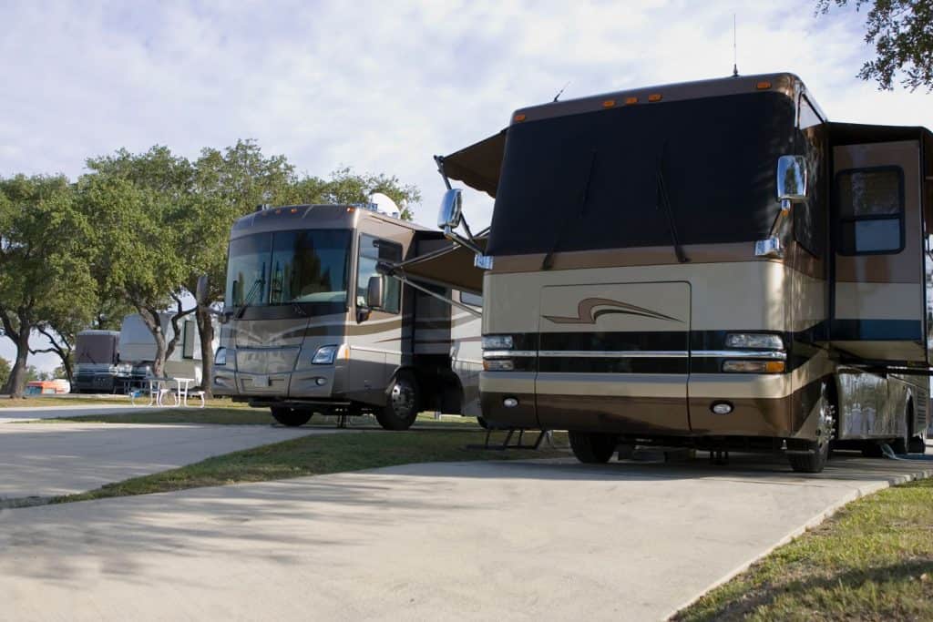 Class A motorhomes with deployed sidings and tents