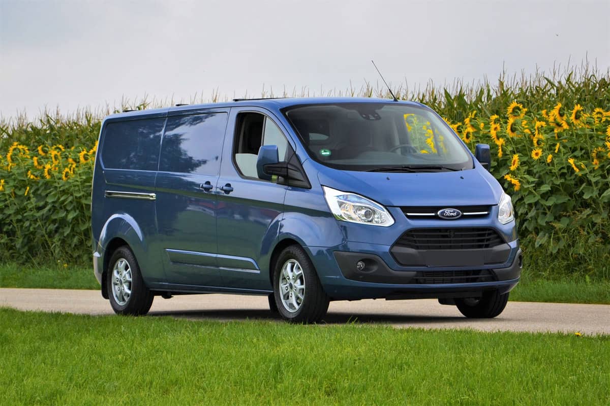 Ford Transit Custom stopped on the road. This model is one of the most popular delivery vans in Europe, How Much Weight Can A Ford Transit Carry?