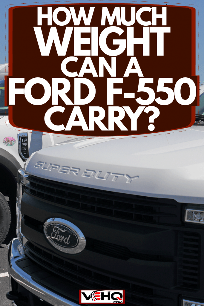 Huge white colored Ford F-550s parked outside a dealership, How Much Weight Can A Ford F-550 Carry?