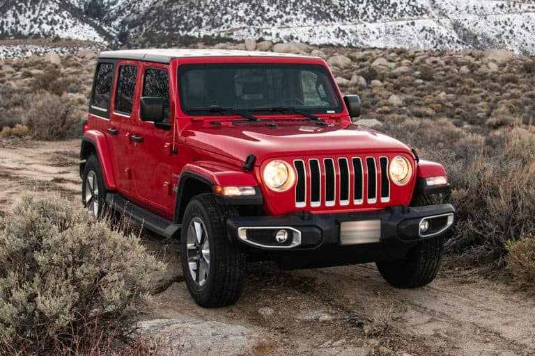 Jeep Wrangler Sahara 2019 edition on a dirt road at the Alabama Hills, Can You Switch To 4 Wheel Drive While Driving? [Popular Off-Road Vehicles Checked]