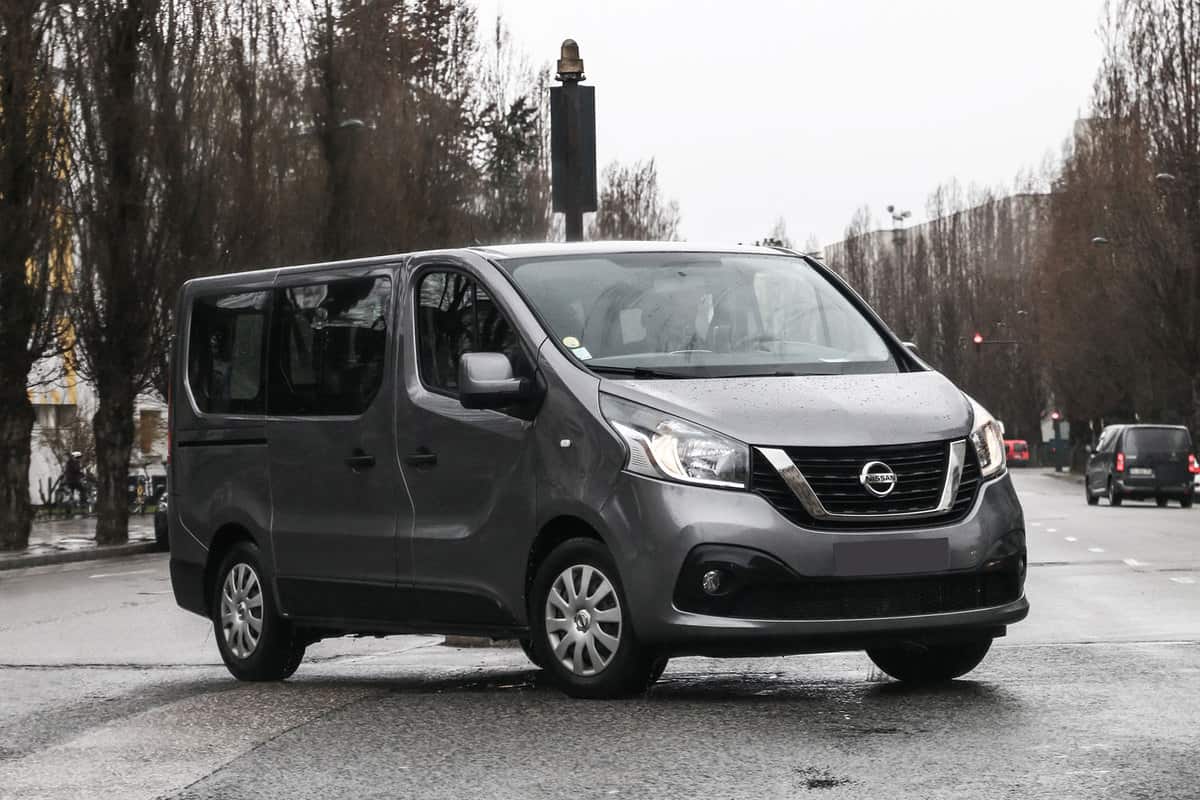 A Nissan NV 300 parked on the middle of the street for a photograph, How Many Passengers does A Nissan NV Hold?