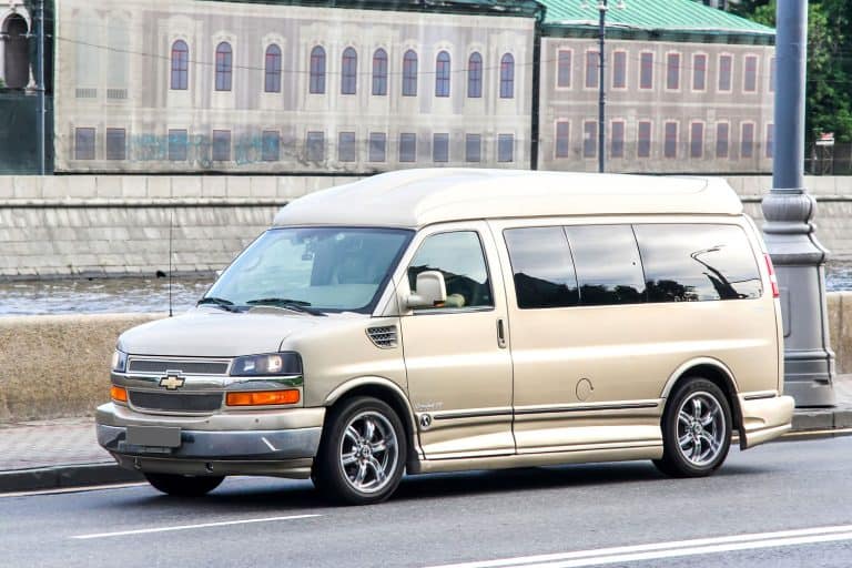 A huge silver colored Chevy Express van moving on the highway, Are Chevy Express Vans 4WD?