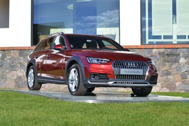 A red Audi A4 allroad parked outside a dealership, Does The Audi A4 Have Folding Mirrors?