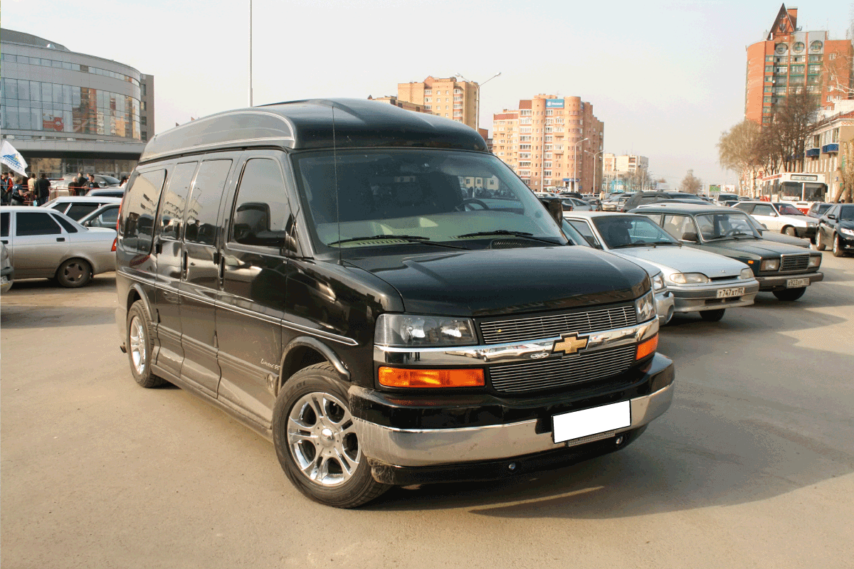 Black luxury van Chevrolet Express in the city street. Can You Add Seats To A Chevy Express Van