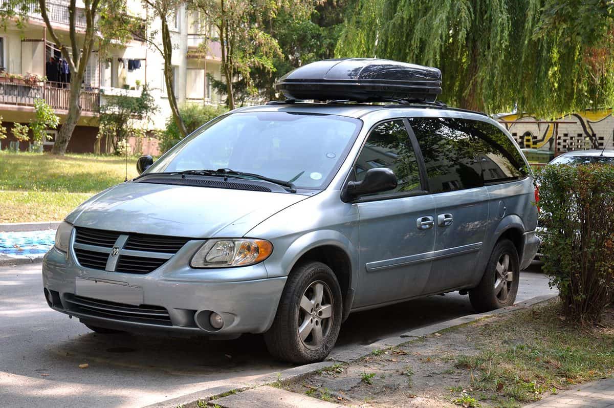 Passenger car with a roof rack parked on the road