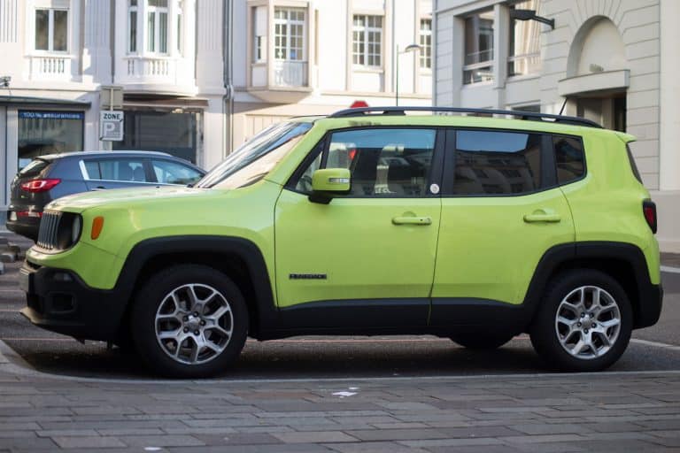 Profile view of green Jeep renegade parked in the street, Jeep is the famous american brand of off road cars, How Much Can A Jeep Renegade Tow?
