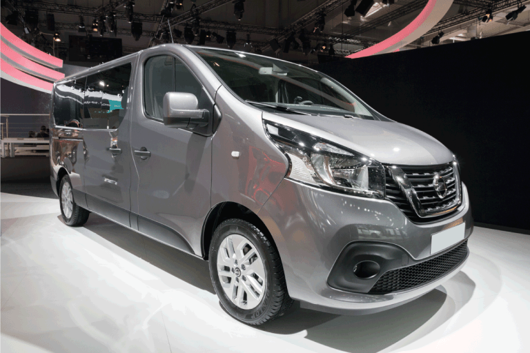 gray nissan nv van presented in an international motor show. How Much Does A Nissan NV Weigh [Inc. 2500 And 3500]