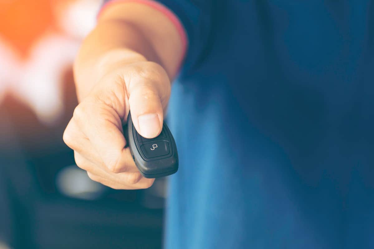 hand-holding-car-keys-remote-control