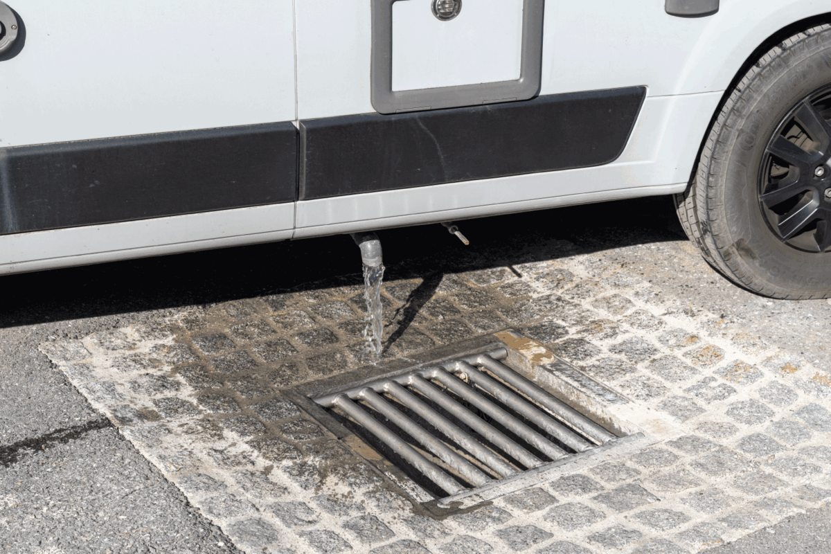 rv unloading gray water into open sewer