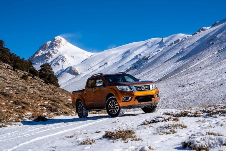 A Nissan Frontier trekking on the snowy terrain, Nissan Frontier Clicking But Not Starting - What Could Be Wrong?