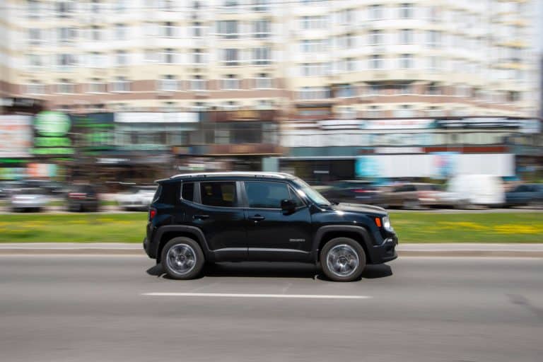 A black Jeep Renegade moving fast on the highway, How Far Can A Jeep Renegade Go On Empty?
