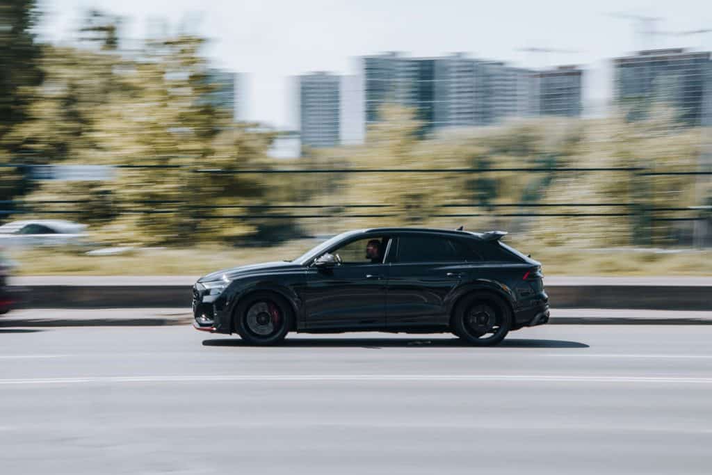 Black Audi SQ8 car moving on the street, How Much Does An Audi SQ8 Weigh?