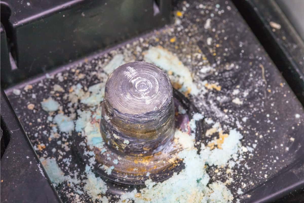 Car battery terminal with corrosion on lead post