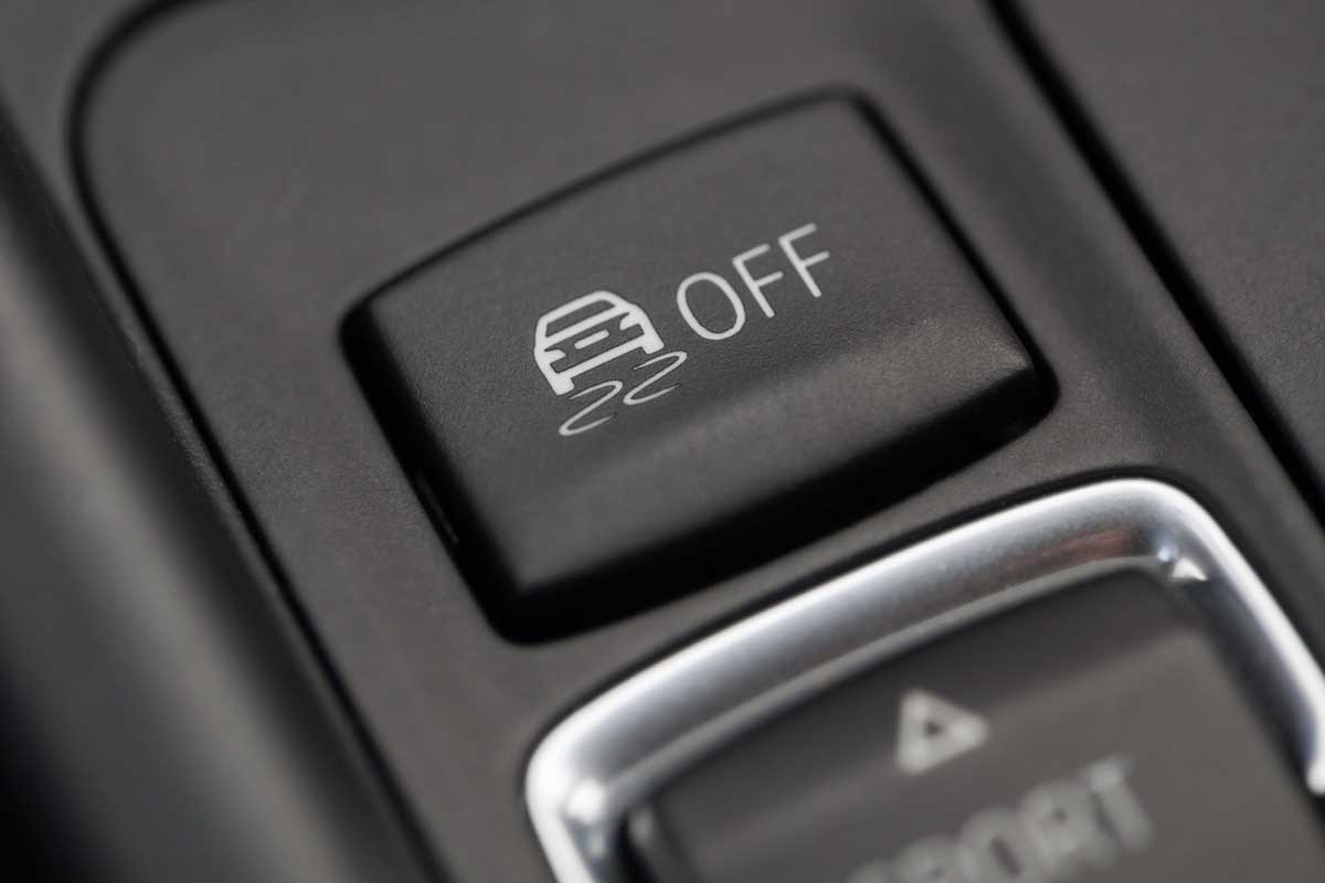 Close up shot of the ESP button in a car, Should Traction Control Always Be On?