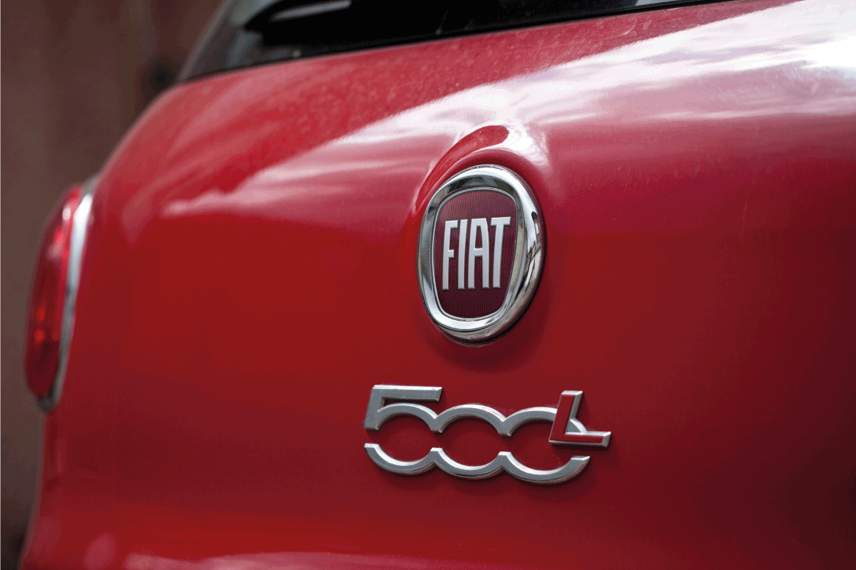 Details and Fiat logo on a red 500L car. How Big Is A Fiat 500L [Height, Width, Length, And Cargo Space]
