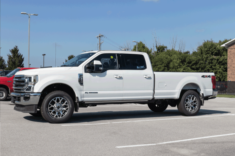 Ford F-350 display at a dealership. The Ford F350 is available in XL, XLT, Lariat, King Ranch, and Platinum models. Can You Convert An F250 To An F350 [Pros, Cons, And How To]
