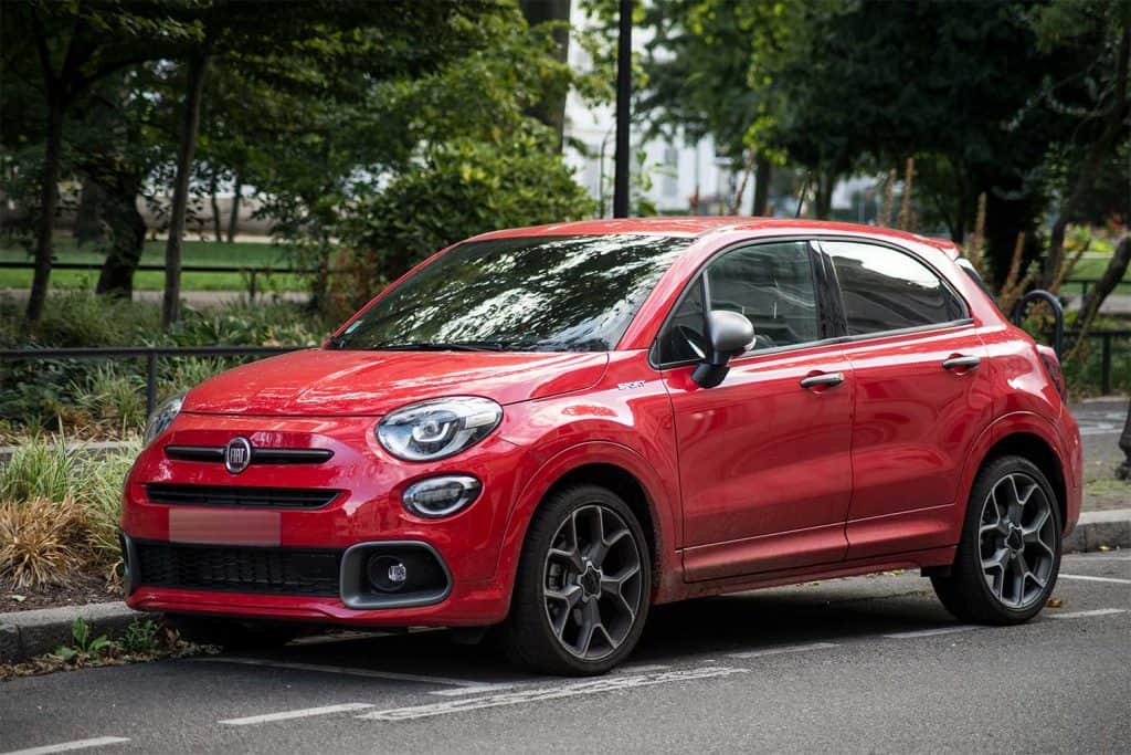 Front view of red Fiat 500X parked in the street