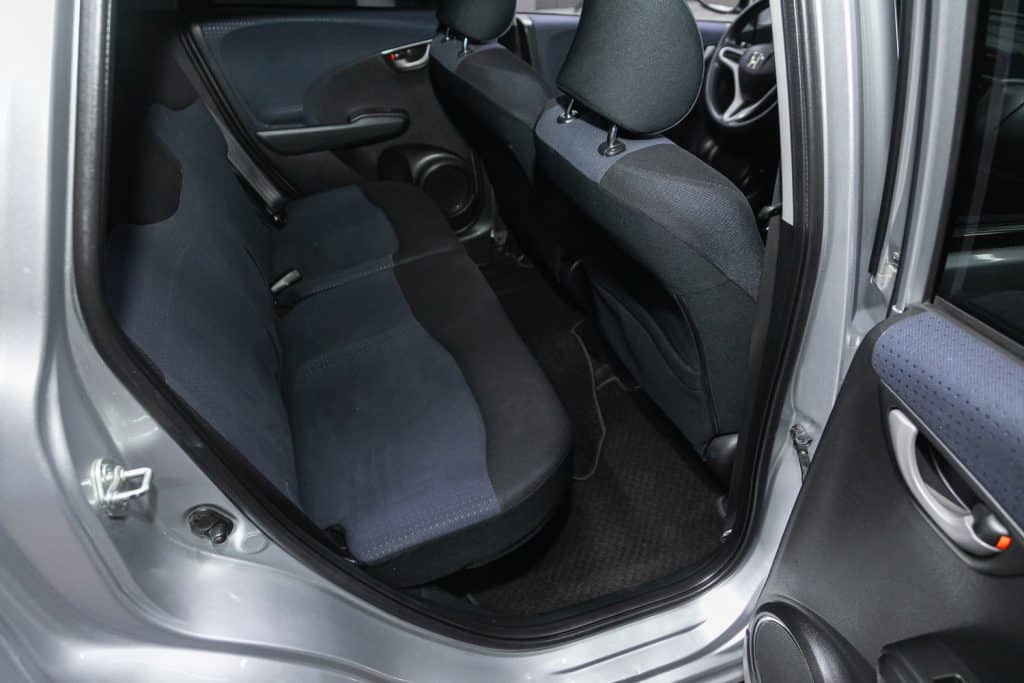 Honda Fit, Comfort car inside. Clean car interior - black back seats, headrests and belt