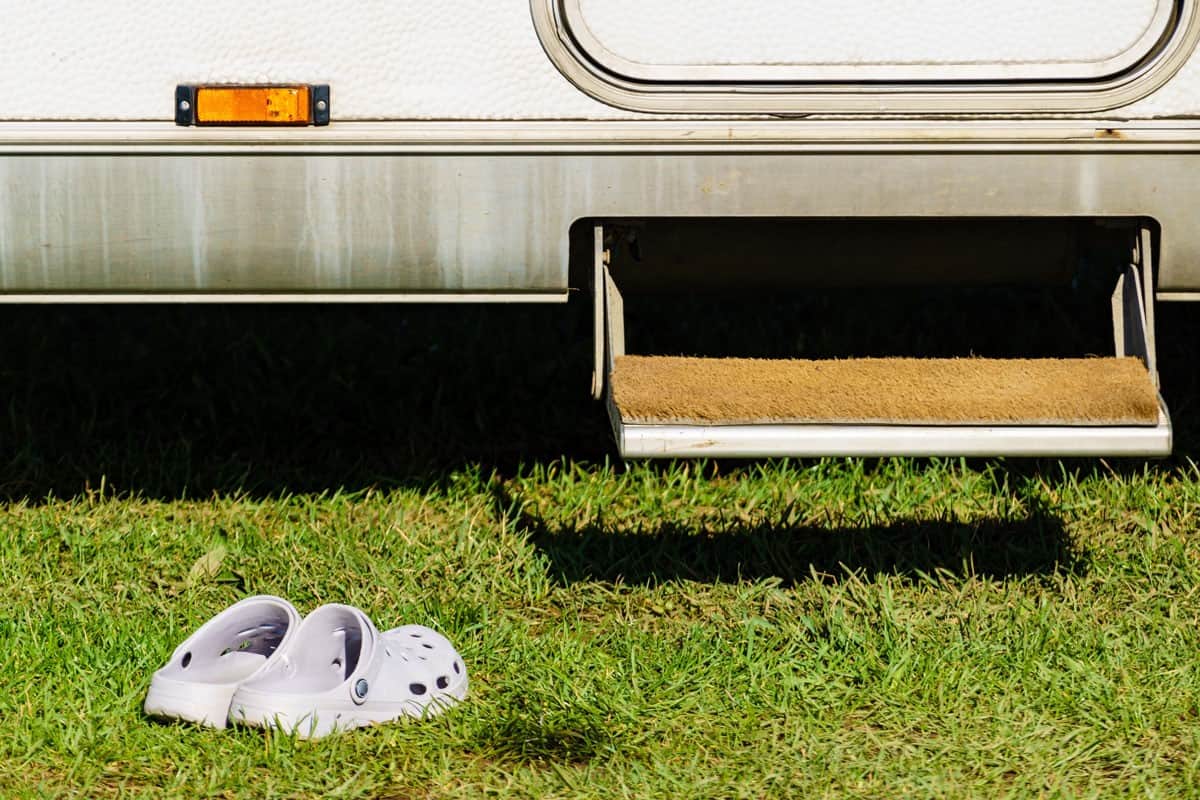 shoes slippers front camper car step grass lawn