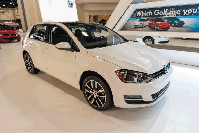 white Volkswagen Golf TSI parked inside a car dealership. Does The Volkswagen Golf Have A Sunroof