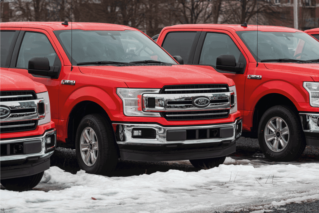 2020 Ford F-150 pickup truck at a dealership with winter landscape