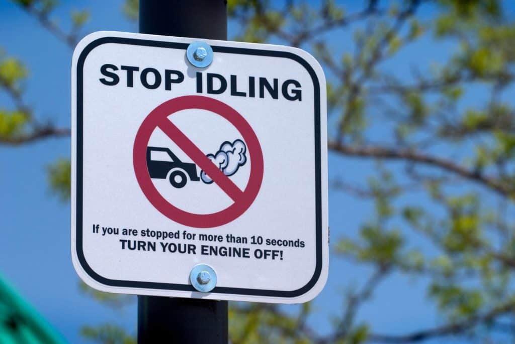 A Stop idling sign installed in a post
