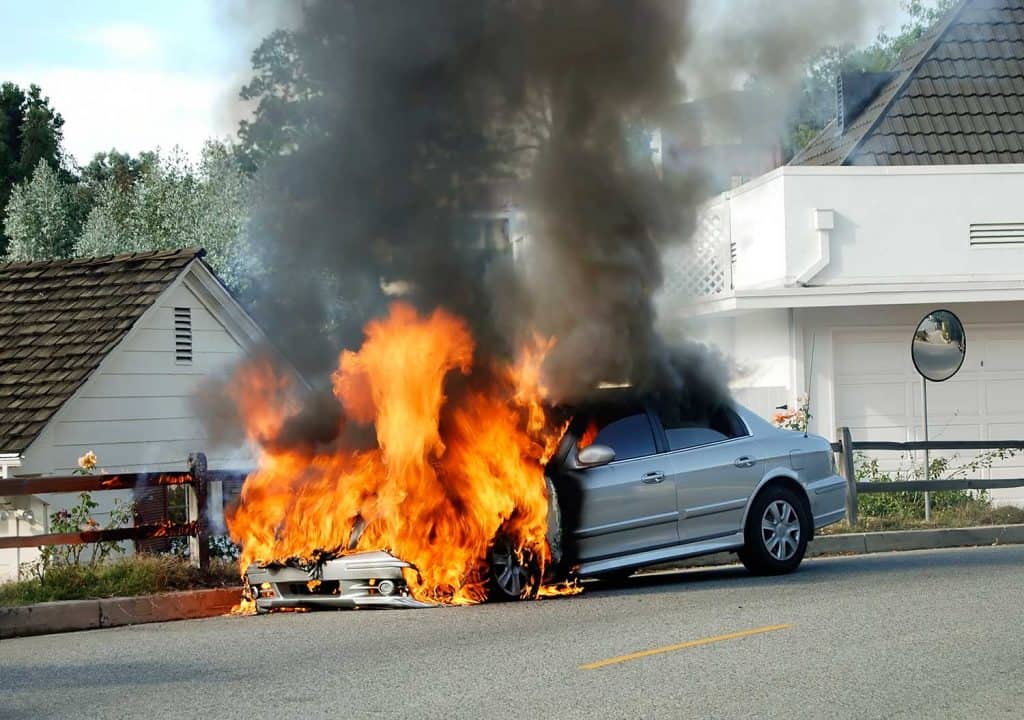 A car burst into flames on a quiet street